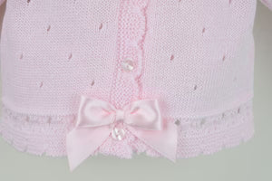 Zoom on stitching and buttons of Pex Miranda pink cardigan