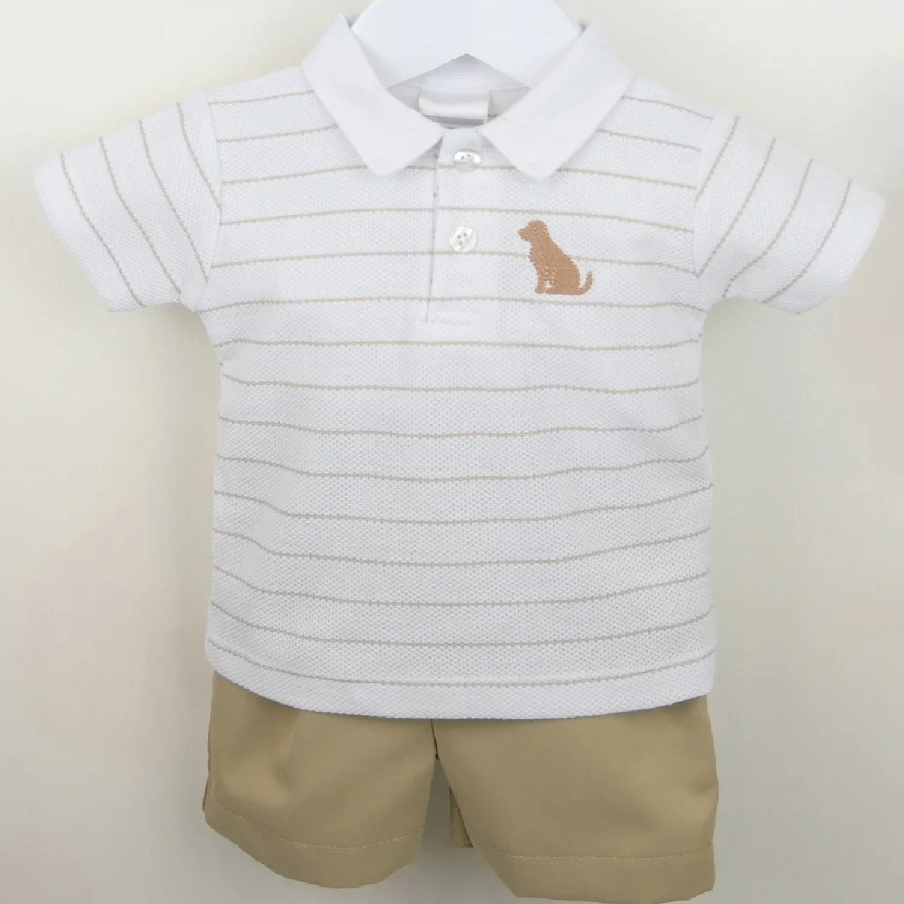 Close-up of Pex Benji polo showing the embroidered puppy detail